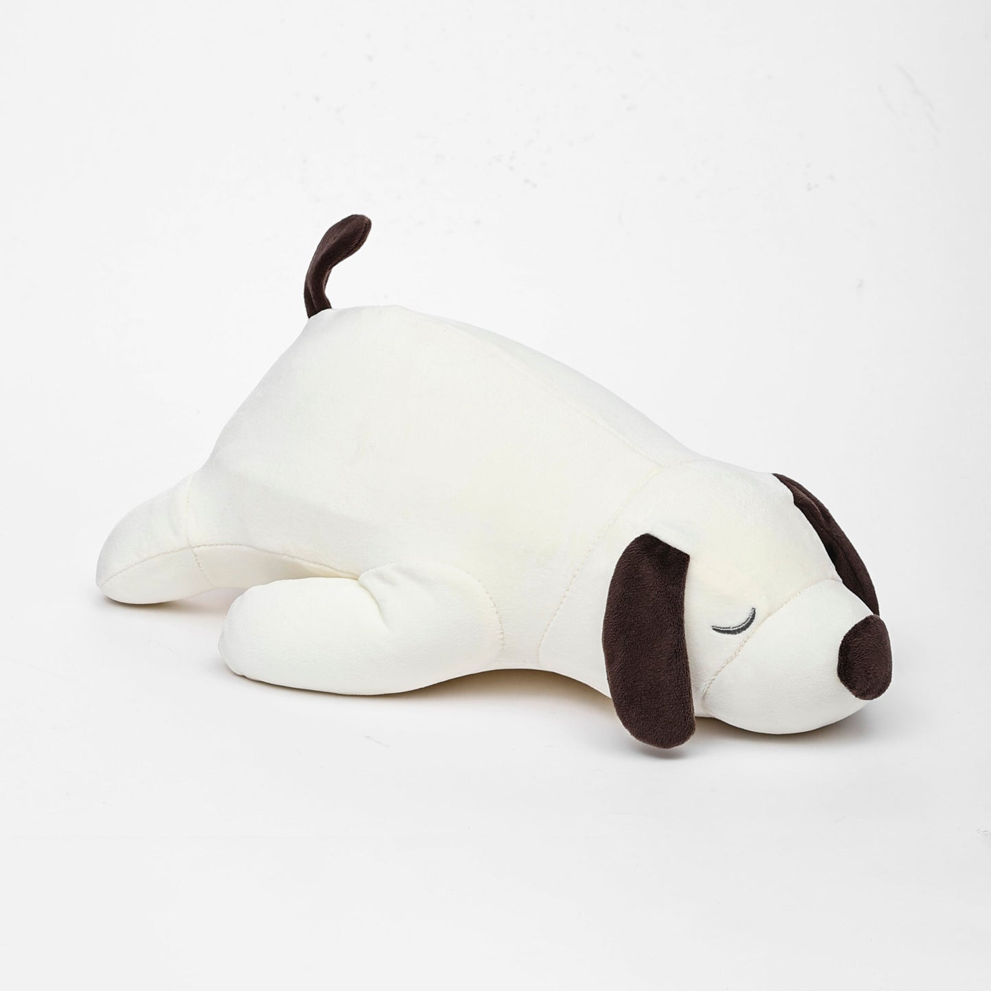 White dog-shaped plush toy with black accents on a white background
